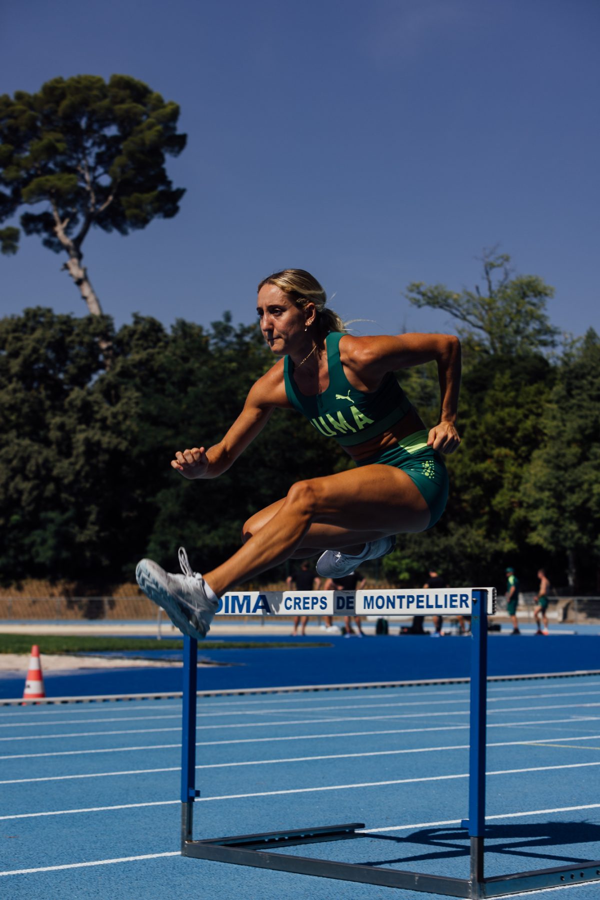 Sarah Carli competes in the women's hurdles at the world cup.