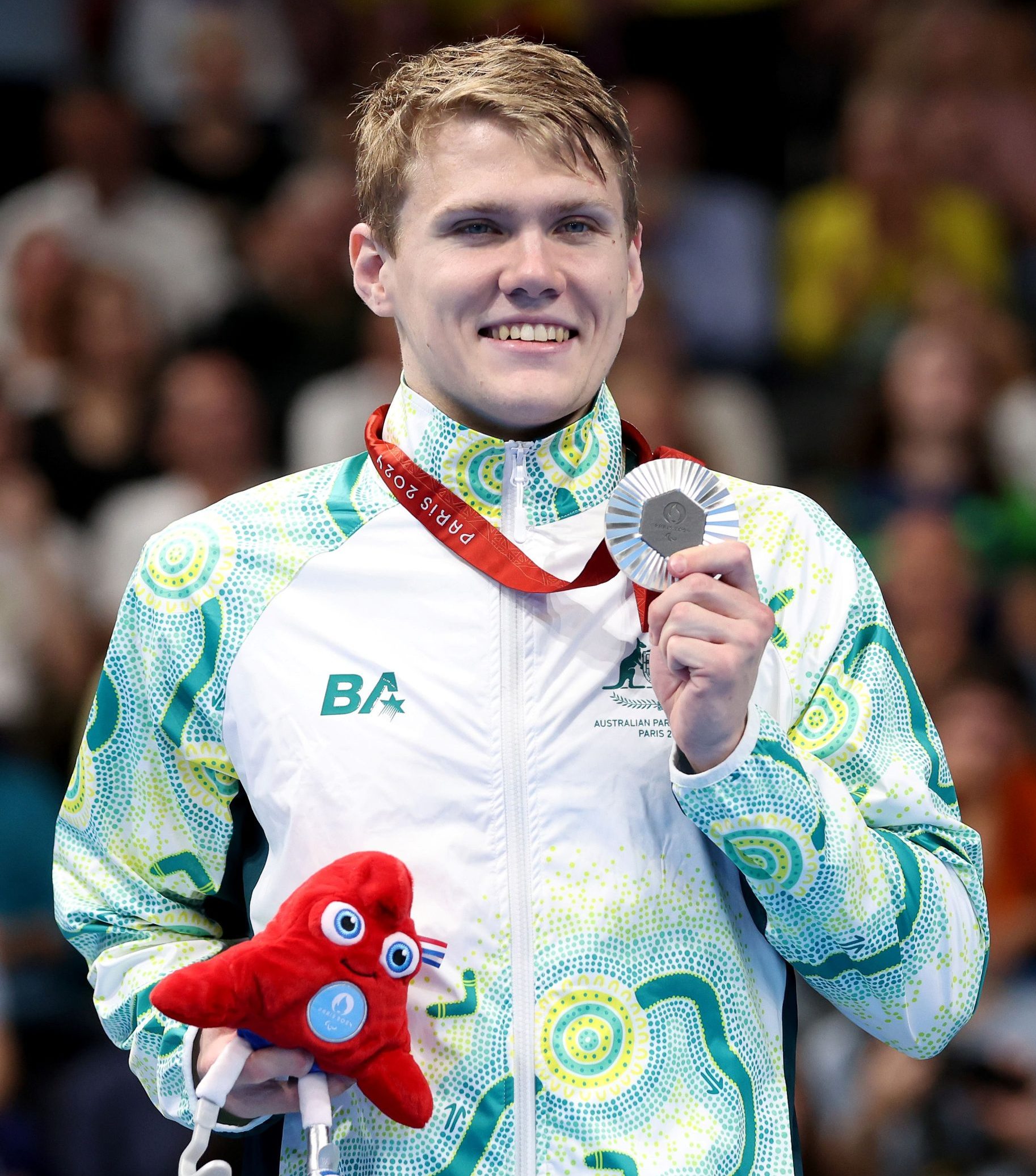 Tim Hodge wins a silver medal in the men's 100m butterfly S9 at the 2024 Paralympic Games.